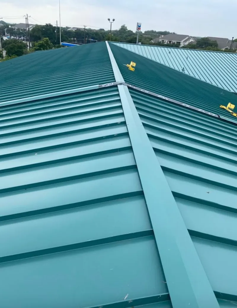 Green commercial metal roof ridge and valley for Metal Roof Repair in Vermilion